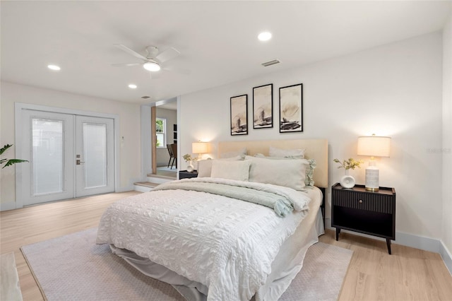 1443 Paloma Ln, Dunedin, FL 34698 - bedroom featuring access to outside, light wood finished floors, french doors, recessed lighting, and baseboards