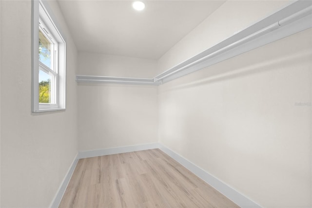 1443 Paloma Ln, Dunedin, FL 34698 - spacious closet featuring wood finished floors