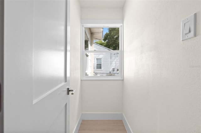 1443 Paloma Ln, Dunedin, FL 34698 - doorway with wood finished floors and baseboards