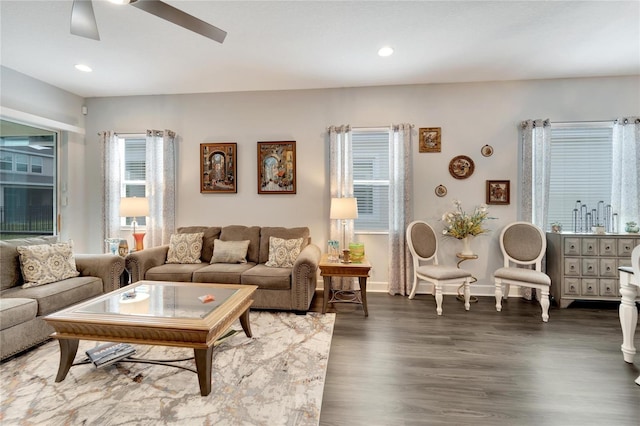 living area featuring baseboards, recessed lighting, ceiling fan, and wood finished floors