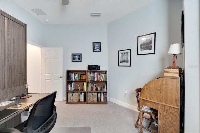 home office with carpet flooring, baseboards, and visible vents