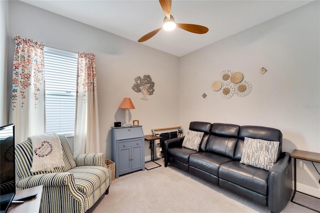 living room featuring a ceiling fan and light carpet