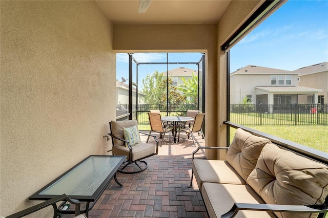 sunroom featuring an outdoor living space
