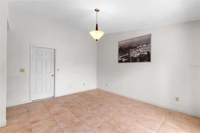spare room with light tile patterned flooring