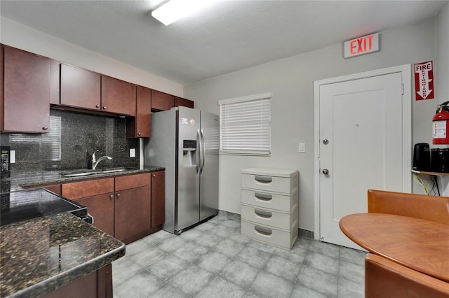 126 Ridgewood Ave, Brandon, FL 33510 - kitchen featuring tasteful backsplash, stainless steel refrigerator with ice dispenser, and a sink