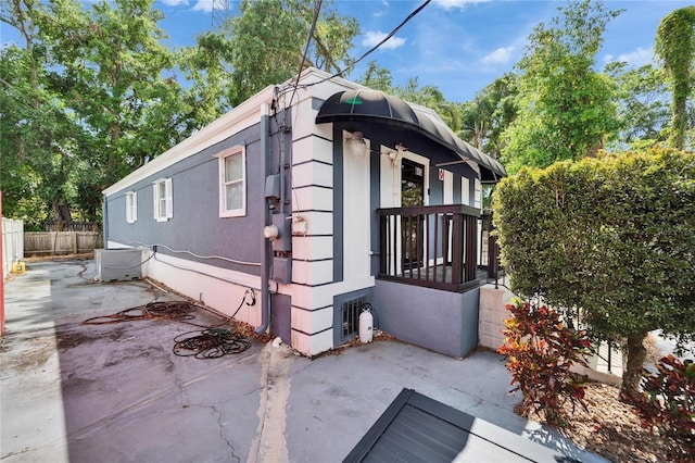 126 Ridgewood Ave, Brandon, FL 33510 - view of property exterior with fence and a patio area