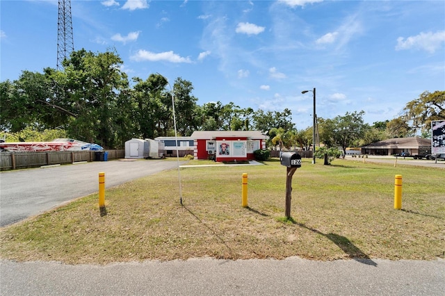126 Ridgewood Ave, Brandon, FL 33510 - view of front facade with fence and a front yard