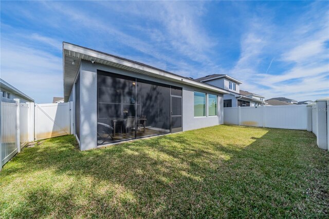 5538 Spanish Moss Cv, Bradenton, FL 34203 - back of house featuring a sunroom and stucco siding
