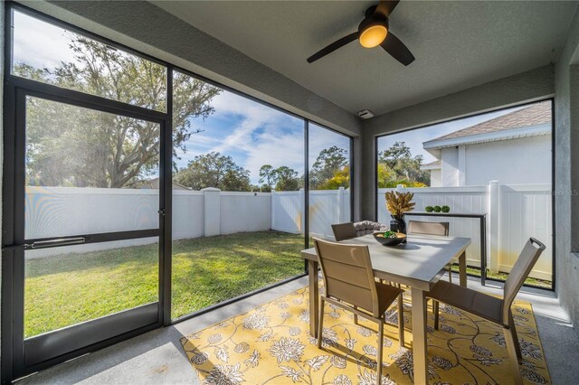 5538 Spanish Moss Cv, Bradenton, FL 34203 - sunroom / solarium featuring ceiling fan and outdoor dining space