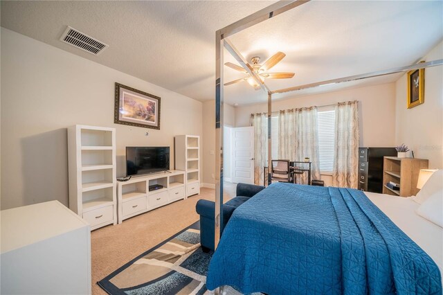 5538 Spanish Moss Cv, Bradenton, FL 34203 - carpeted bedroom featuring ceiling fan and a textured ceiling
