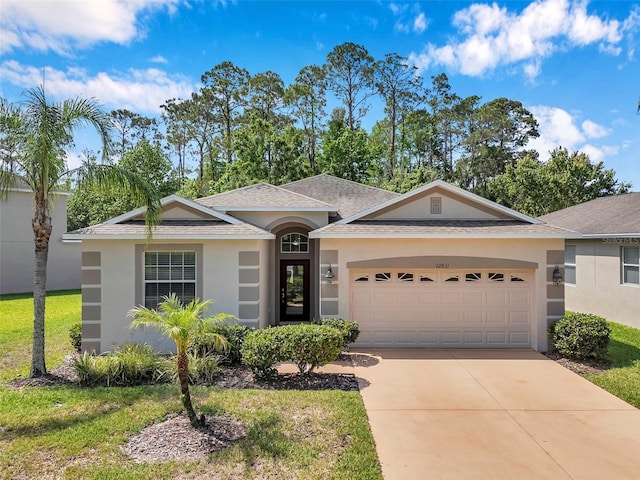 12831 White Bluff Rd, Hudson, FL 34669 - single story home with stucco siding, a garage, a shingled roof, and driveway