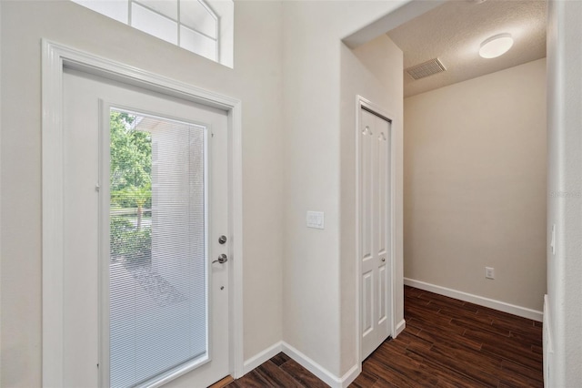 12831 White Bluff Rd, Hudson, FL 34669 - foyer with baseboards and dark wood finished floors