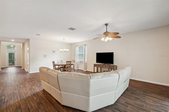 12831 White Bluff Rd, Hudson, FL 34669 - living room featuring dark wood-type flooring and baseboards