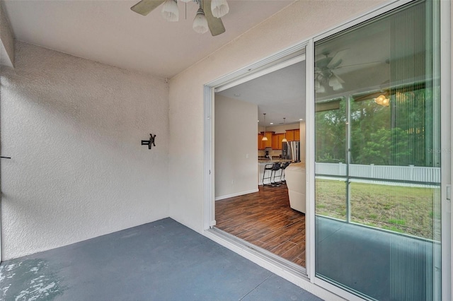 12831 White Bluff Rd, Hudson, FL 34669 - doorway to property with a ceiling fan and stucco siding