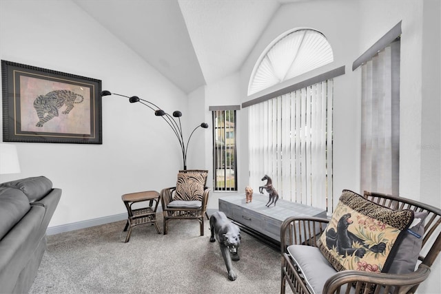 sitting room with baseboards, carpet floors, and vaulted ceiling