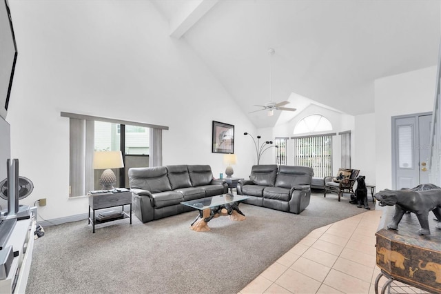carpeted living area with a healthy amount of sunlight, ceiling fan, and high vaulted ceiling