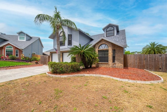 view of front facade with concrete driveway, brick siding, fence, and a garage