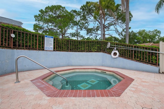 view of pool with a community hot tub