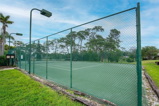 view of sport court with fence