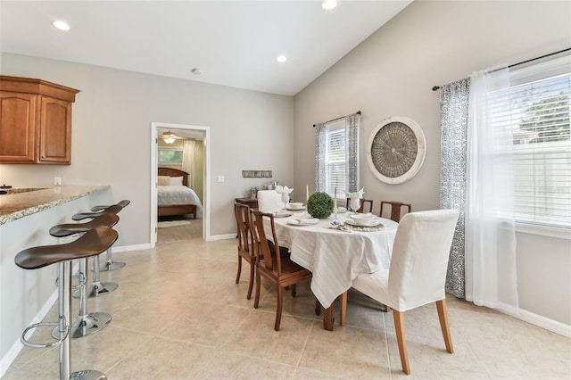 5235 42nd St S, Saint Petersburg, FL 33711 - dining area featuring lofted ceiling, baseboards, recessed lighting, light tile patterned floors, and ceiling fan