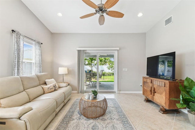 5235 42nd St S, Saint Petersburg, FL 33711 - living room featuring healthy amount of natural light, ceiling fan, light tile patterned floors, baseboards, and recessed lighting