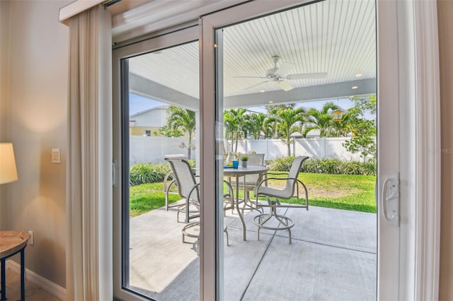 5235 42nd St S, Saint Petersburg, FL 33711 - doorway to outside featuring ceiling fan and baseboards