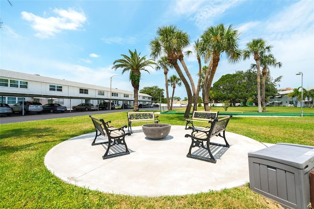 5356 81st St N Unit 26, Saint Petersburg, FL 33709 - view of patio / terrace featuring a fire pit