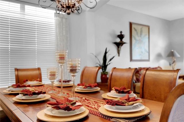 dining room with a notable chandelier