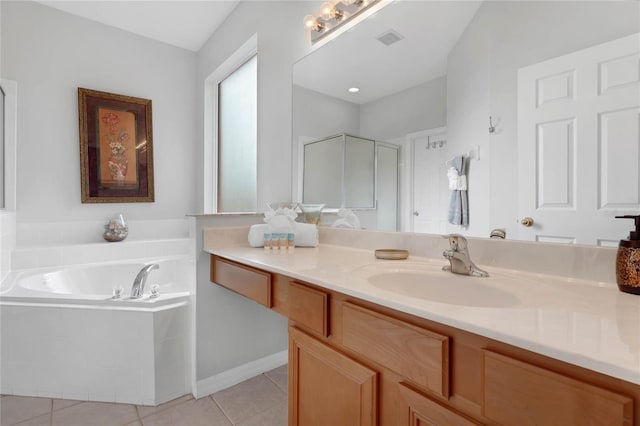full bathroom featuring a garden tub, visible vents, tile patterned flooring, a shower stall, and vanity