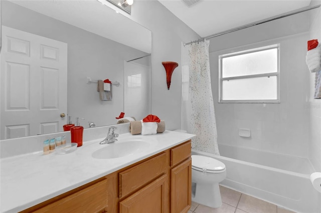 full bath with tile patterned flooring, shower / bath combination with curtain, toilet, and vanity