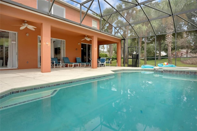 outdoor pool featuring a lanai, ceiling fan, and a patio area