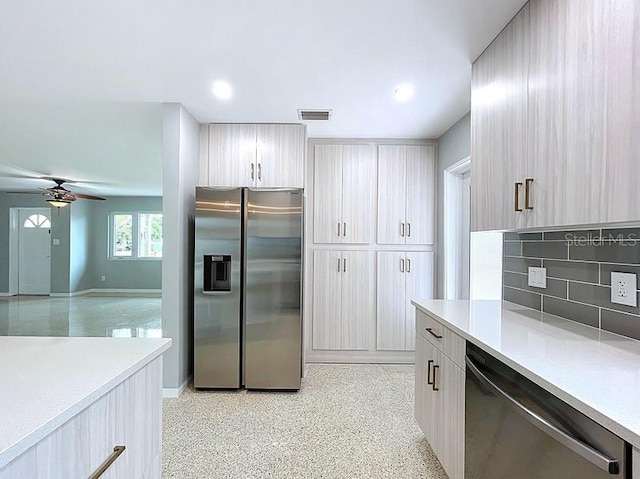 6268 39th Ave N, Saint Petersburg, FL 33709 - kitchen with visible vents, decorative backsplash, ceiling fan, light countertops, and stainless steel appliances