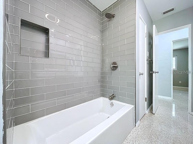 6268 39th Ave N, Saint Petersburg, FL 33709 - bathroom featuring baseboards, visible vents, washtub / shower combination, and speckled floor