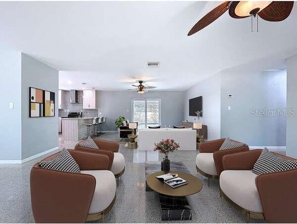6268 39th Ave N, Saint Petersburg, FL 33709 - living area with a ceiling fan, baseboards, visible vents, and speckled floor
