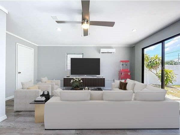 6268 39th Ave N, Saint Petersburg, FL 33709 - living area with ceiling fan, ornamental molding, baseboards, and a wall unit AC