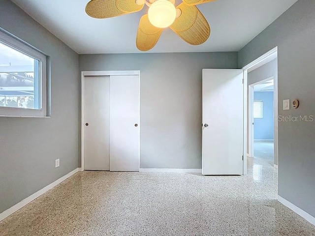 6268 39th Ave N, Saint Petersburg, FL 33709 - unfurnished bedroom featuring baseboards, multiple windows, a closet, and ceiling fan