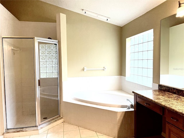 full bathroom with vanity, tile patterned flooring, a shower stall, and a bath