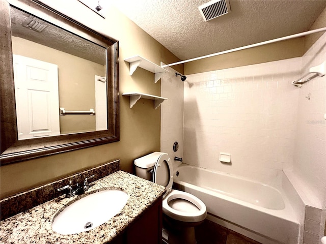 full bathroom featuring visible vents, vanity, toilet, shower / tub combination, and a textured ceiling