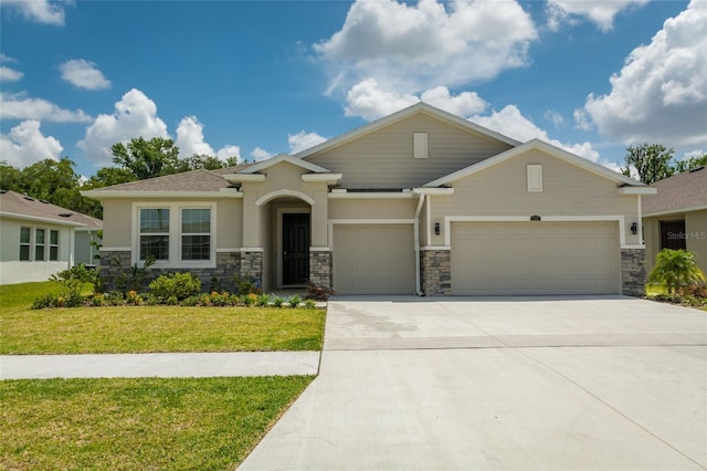 view of front facade with a front lawn, stone siding, a garage, stucco siding, and driveway