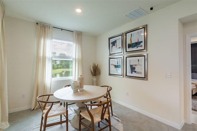 dining room featuring baseboards, recessed lighting, light tile patterned flooring, and visible vents