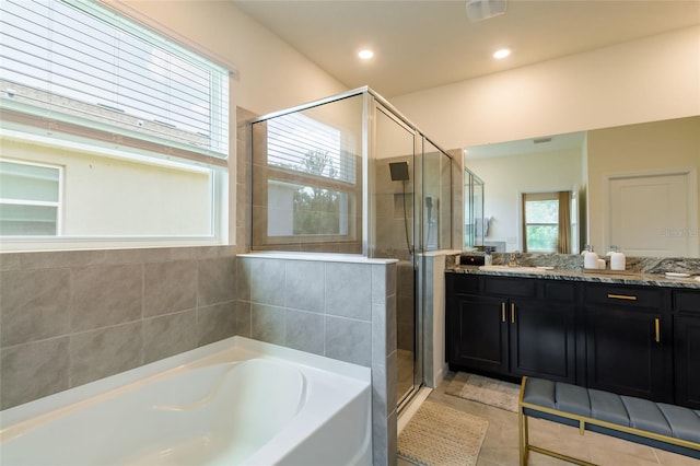 full bathroom featuring a garden tub, tile patterned flooring, a stall shower, and vanity
