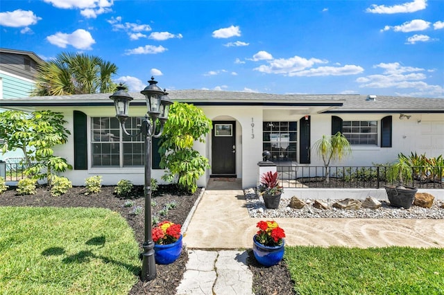 1913 Poinsetta Ln, Maitland, FL 32751 - single story home featuring a porch, roof with shingles, and concrete block siding