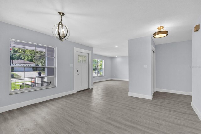 1913 Poinsetta Ln, Maitland, FL 32751 - entrance foyer featuring wood finished floors, a chandelier, baseboards, and recessed lighting