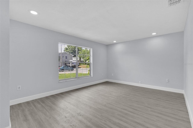 1913 Poinsetta Ln, Maitland, FL 32751 - spare room featuring wood finished floors, baseboards, and recessed lighting