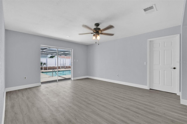 1913 Poinsetta Ln, Maitland, FL 32751 - empty room featuring ceiling fan, wood finished floors, and baseboards