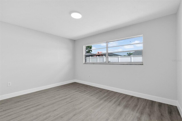 1913 Poinsetta Ln, Maitland, FL 32751 - unfurnished room with wood finished floors and baseboards