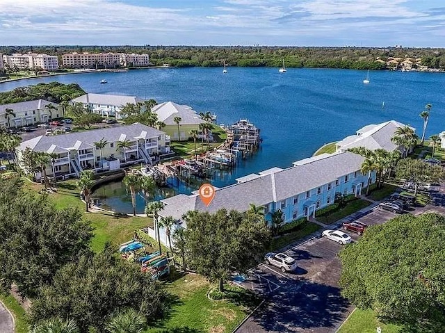 birds eye view of property featuring a water view