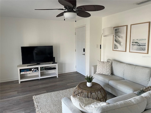 living room with ceiling fan, baseboards, visible vents, and wood finished floors