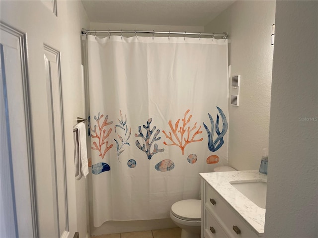 full bathroom featuring vanity, tile patterned flooring, toilet, and curtained shower