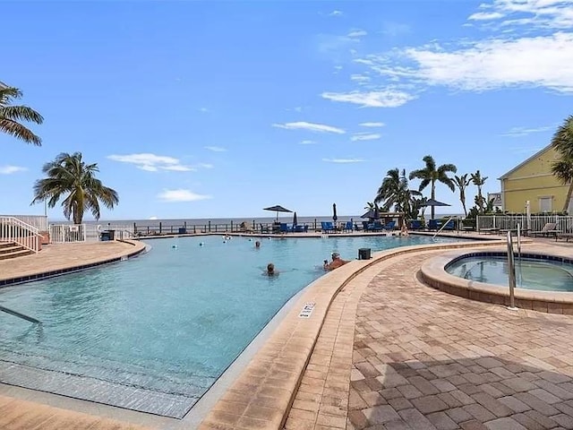 community pool with a community hot tub